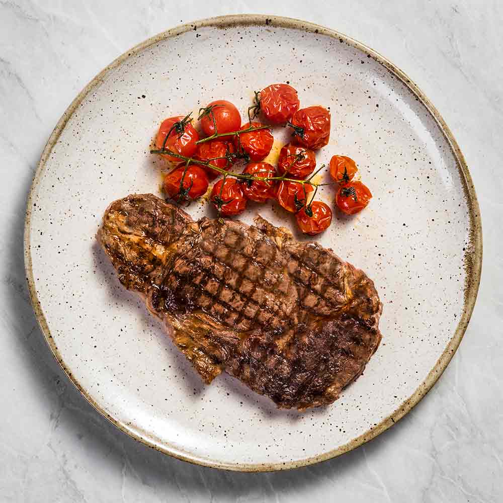 Receita de Bife Ancho com tomate assado na brasa